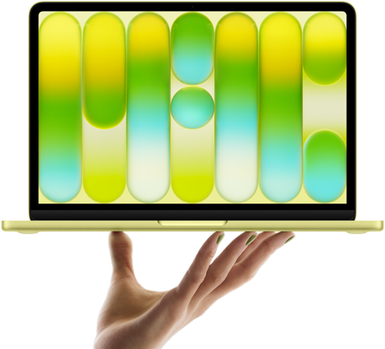 MacBook Neo w kolorze cytrusowożółtym, leżący na palcach otwartej dłoni, na ekranie widać kolorowy abstrakcyjny wzór