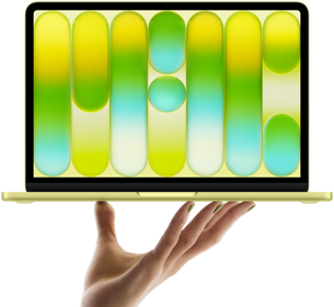 MacBook Neo w kolorze cytrusowożółtym, leżący na palcach otwartej dłoni, na ekranie widać kolorowy abstrakcyjny wzór