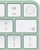 Klawiatura Magic Keyboard, prawy górny róg, kolor zielony, czytnik Touch ID, klawisz Delete i&nbsp;klawisze regulacji głośnościi
