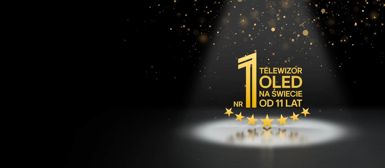 Złoty emblemat „Najlepszy na świecie OLED TV od 11 lat” na czarnym tle. Na emblemacie świeci reflektor, a złote abstrakcyjne gwiazdy wypełniają niebo powyżej.
