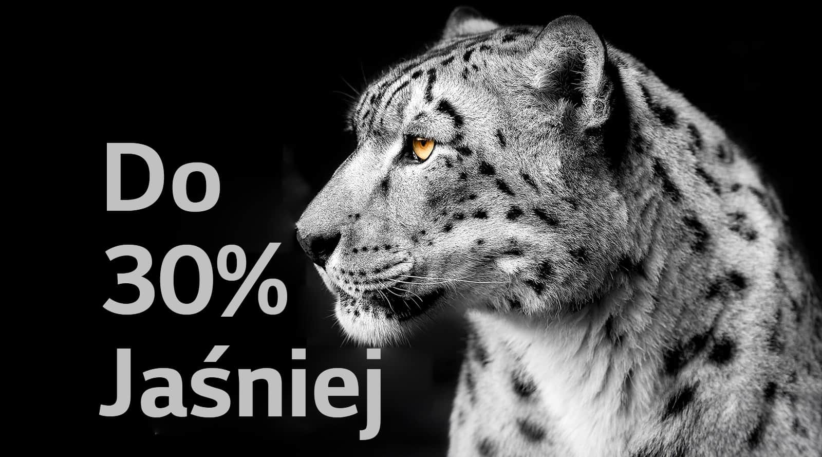 Biały lampart prezentujący bok pyska po lewej stronie obrazu. Po lewej stronie pojawia się napis „Do 30% jaśniej”.