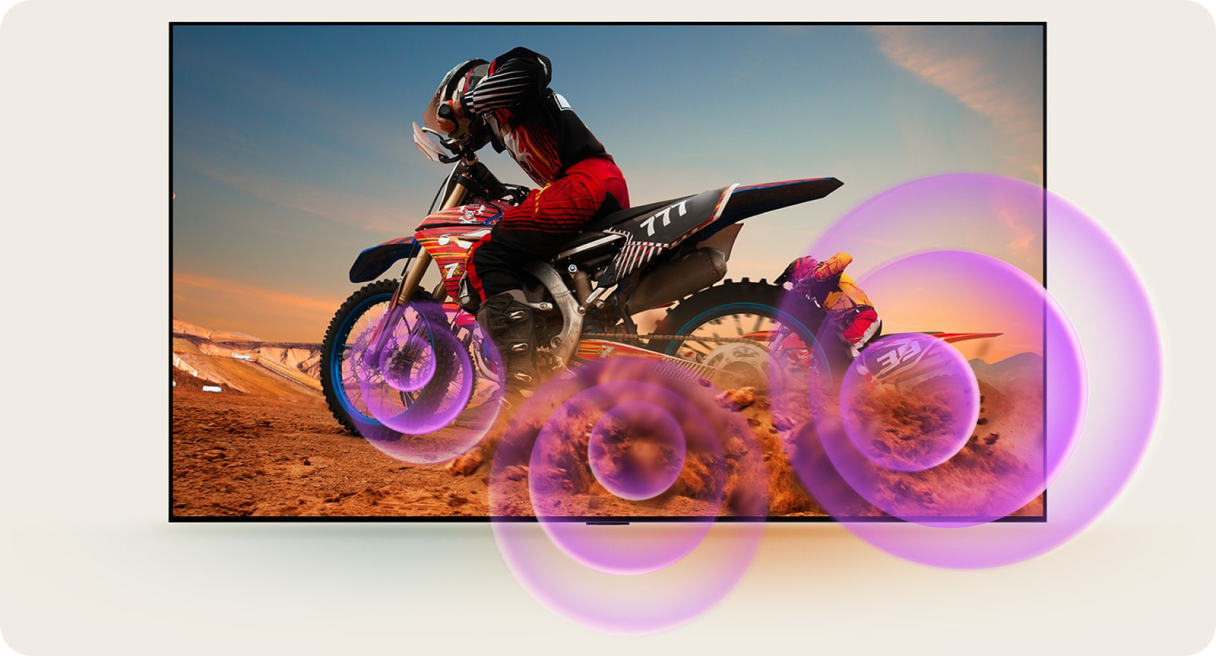 Mężczyzna na motocrossie i fioletowe okręgi o różnych rozmiarach, symbolizujące fale dźwiękowe