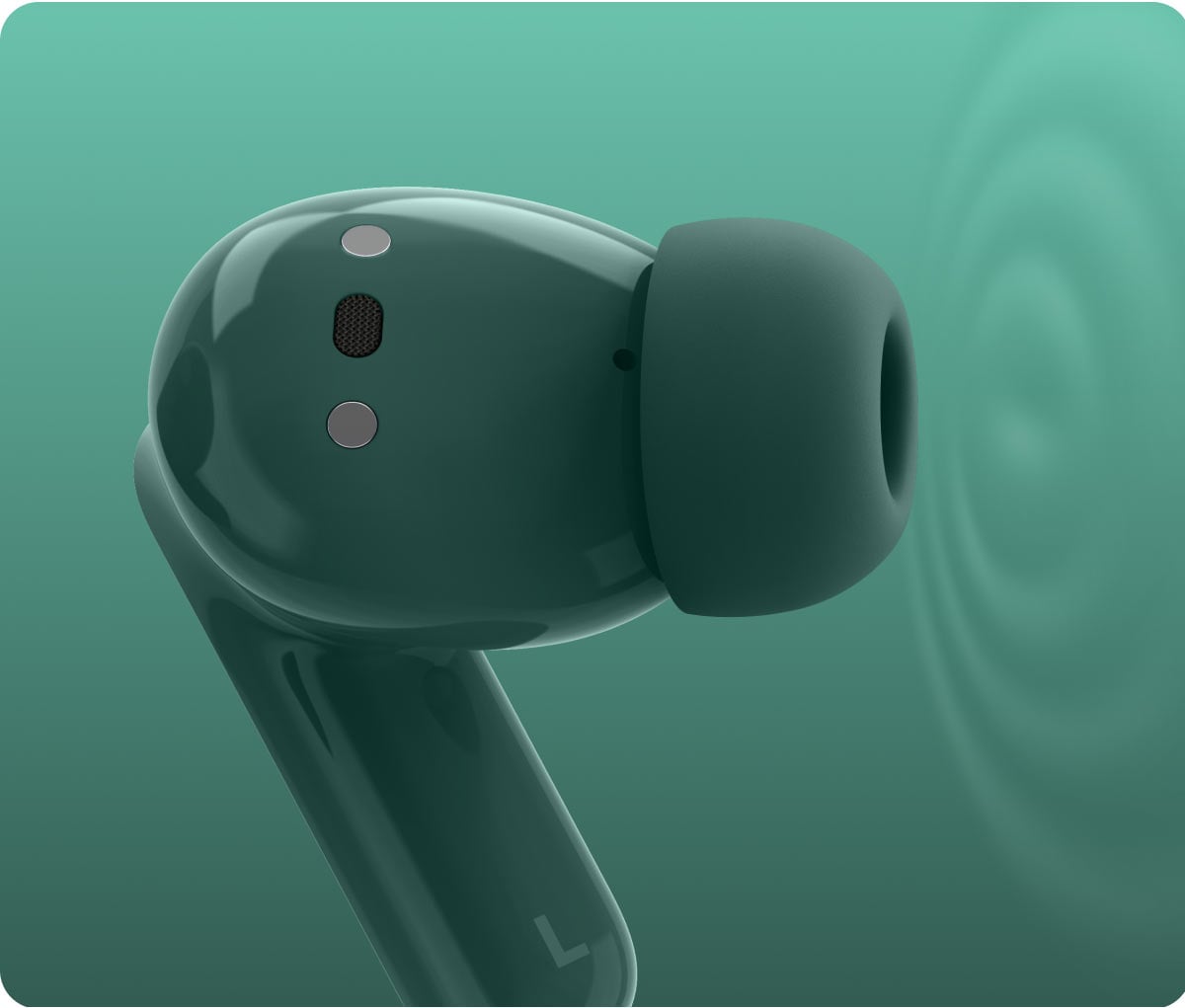 Powiększony widok na pojedynczą zieloną słuchawkę, pokazujący czujniki i wyprofilowaną końcówkę douszną