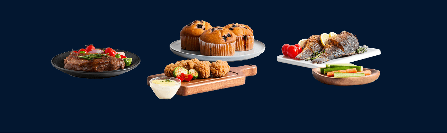 Zestaw dań: stek z pomidorkami, muffinki, panierowane kąski z sosem, pieczona ryba z cytryną oraz słupki warzyw
